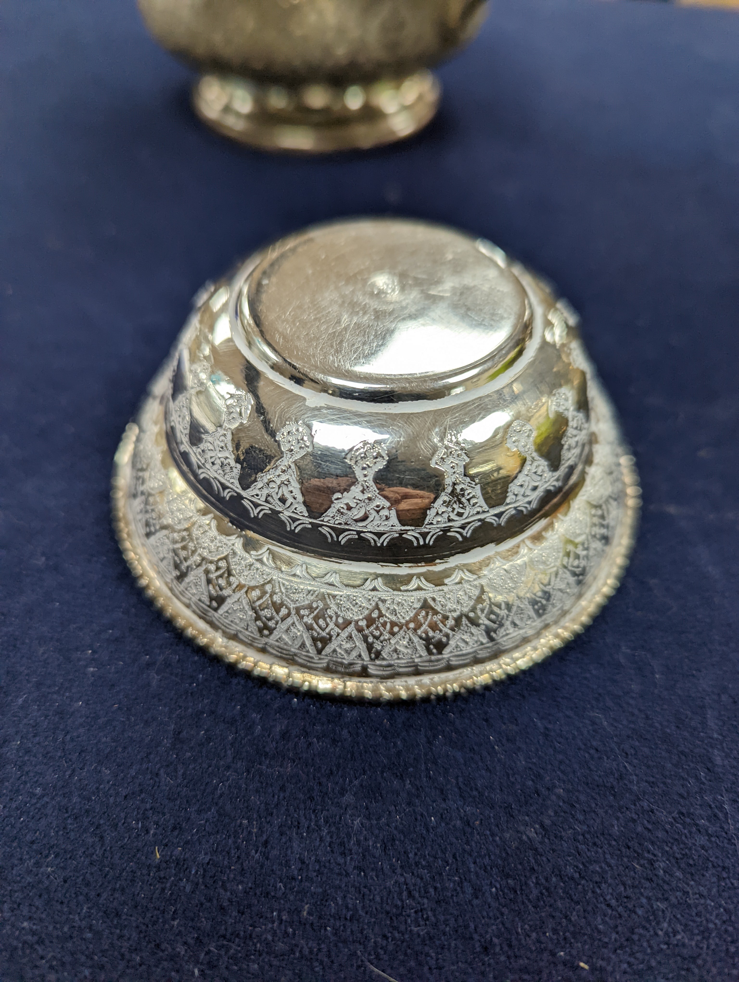 A set of six Persian embossed 84 standard white metal coffee cup holders and matching sugar bowl and cover by Vartan and four other Persian white metal items.